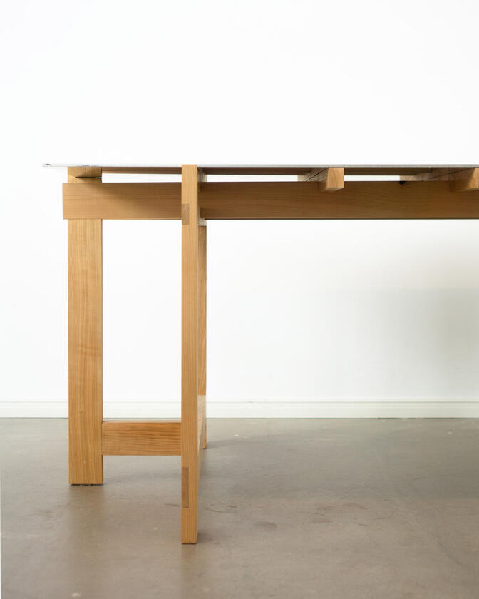 alu studio desk a desk made of solid european cherry wood with a surface of handbrushed aluminium designed by Liam Barwick