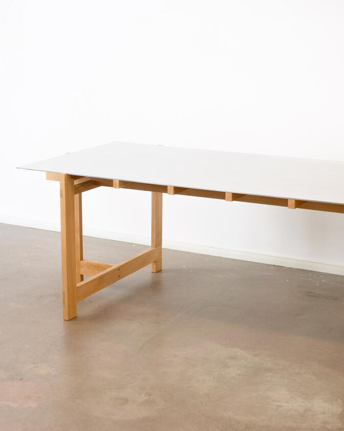 alu studio desk a desk made of solid european cherry wood with a surface of handbrushed aluminium designed by Liam Barwick
