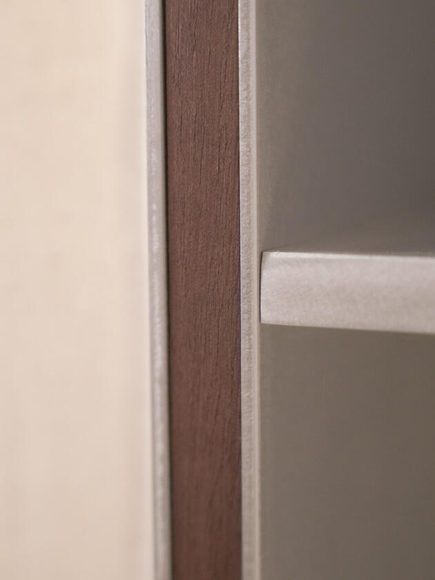 ritual lamp A wall lamp made of hand brushed aluminium with a strip of dark hardwood and a soft calico cover. Designed and made by Liam Barwick