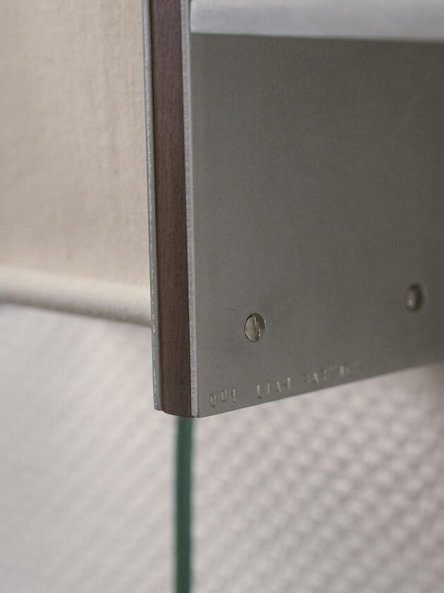 ritual lamp A wall lamp made of hand brushed aluminium with a strip of dark hardwood and a soft calico cover. Designed and made by Liam Barwick