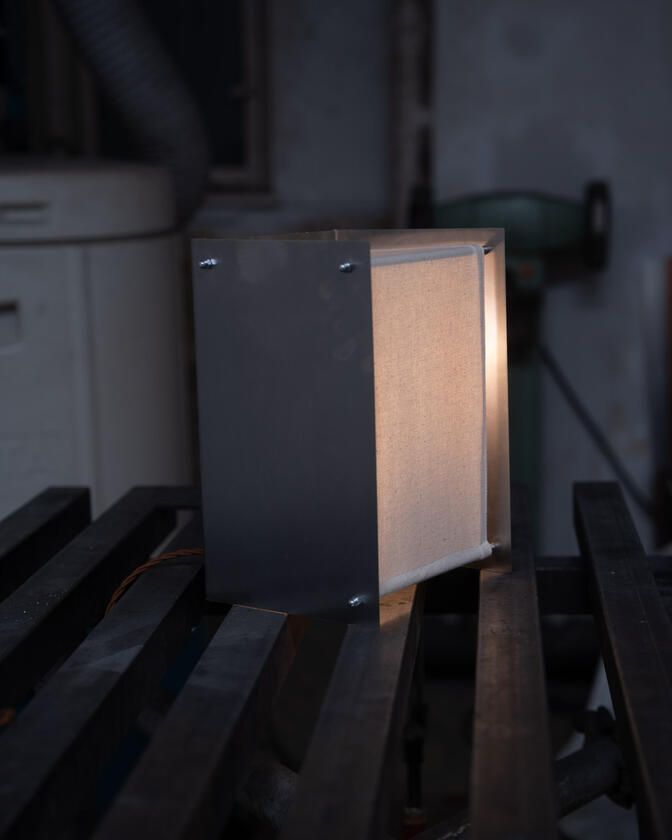 lamp 001 A table lamp constructed of a raw steel exterior and a soft organic cotton canvas diffuser. Designed and constructed by Liam Barwick