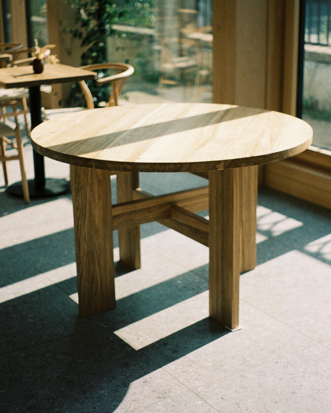 round table A large wooden round table 120cm in diameter made of solid ash wood. Designed and made by Liam Barwick