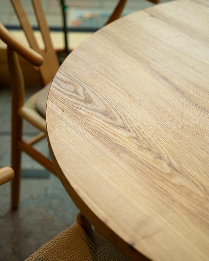 round table A large wooden round table 120cm in diameter made of solid ash wood. Designed and made by Liam Barwick